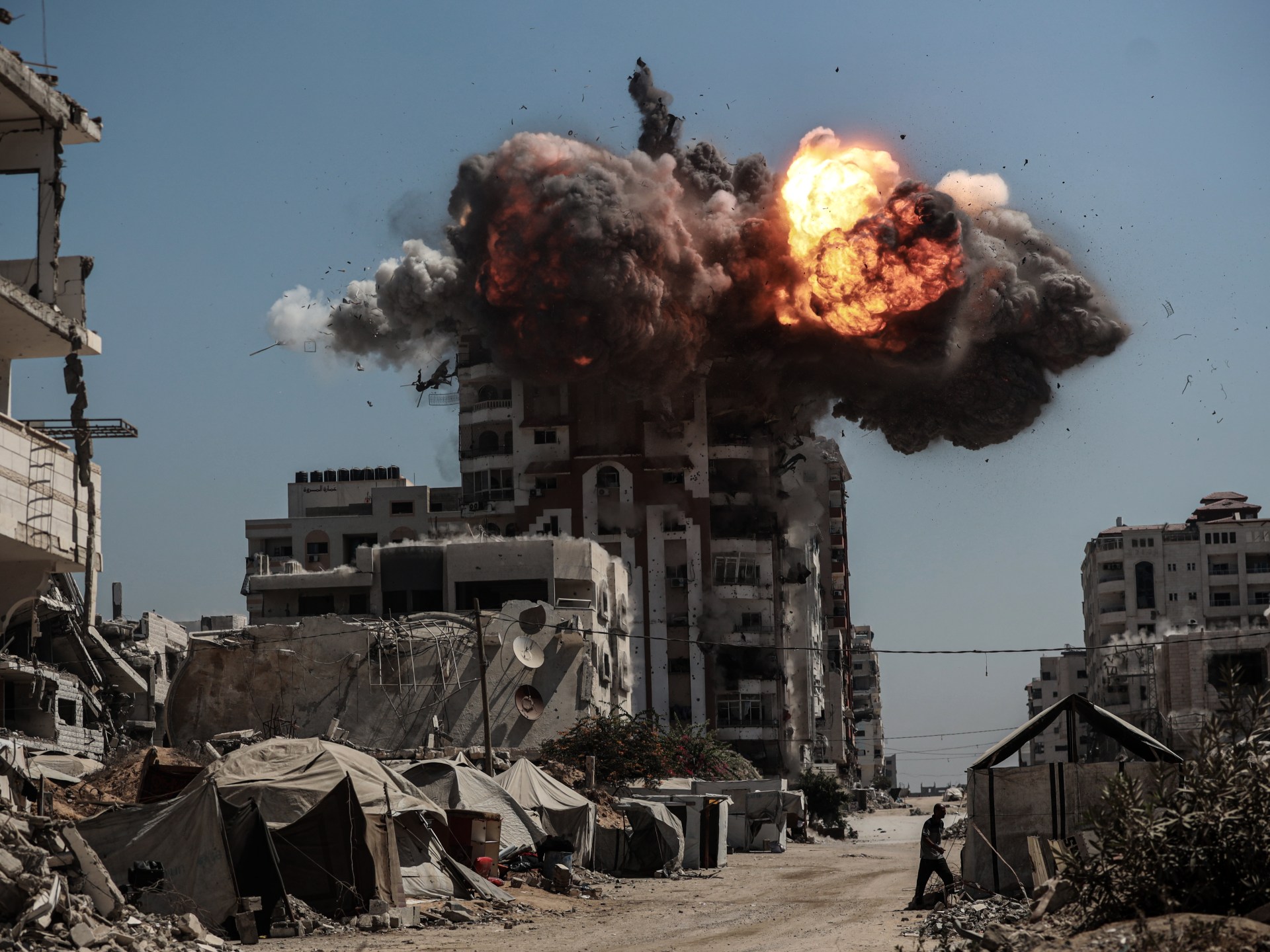 Israel flattens more Gaza towers as strikes kill 53 and famine toll rises | Arab League News
